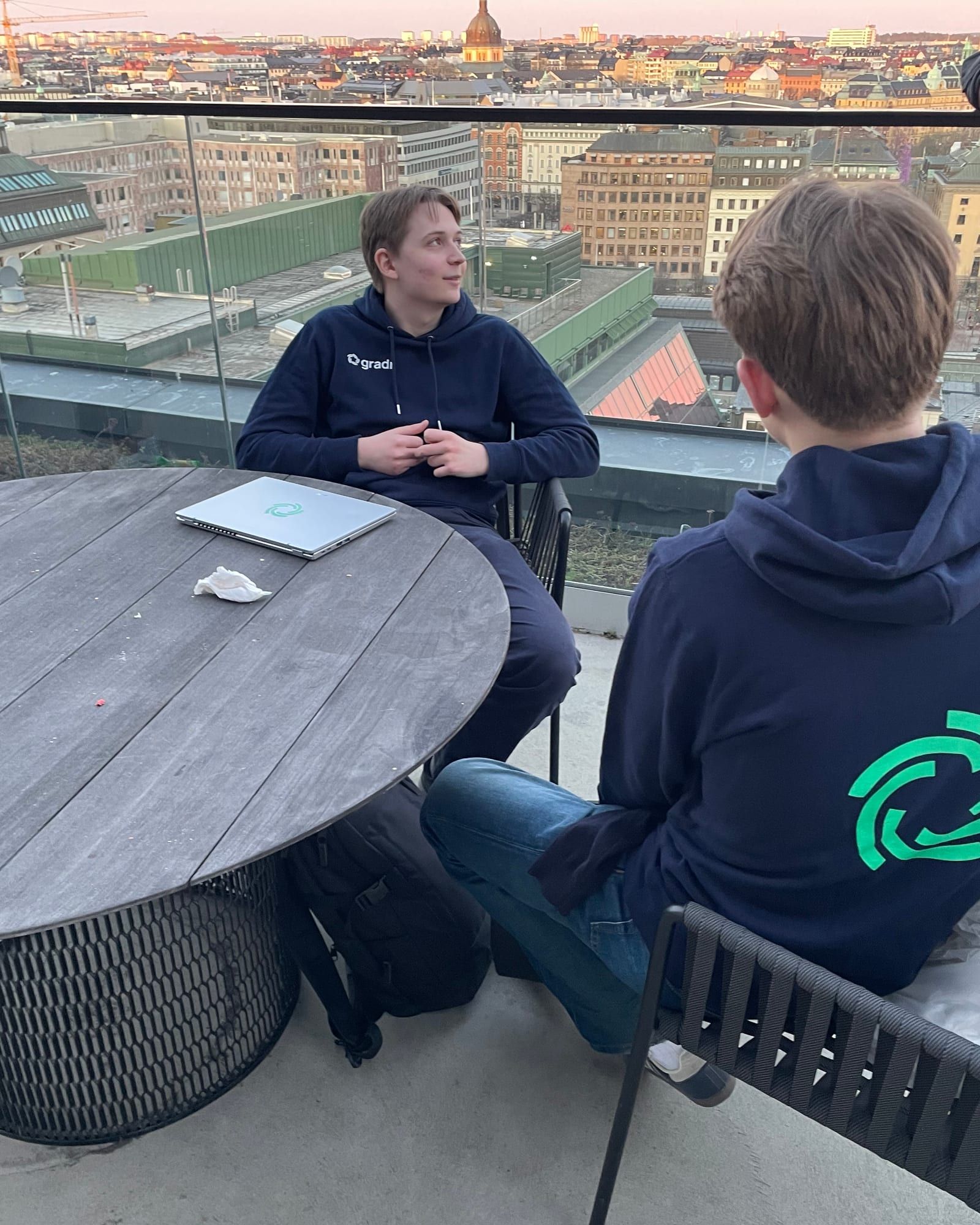 Two of the Gradr team at an event on a rooftop terrace above Stockholm